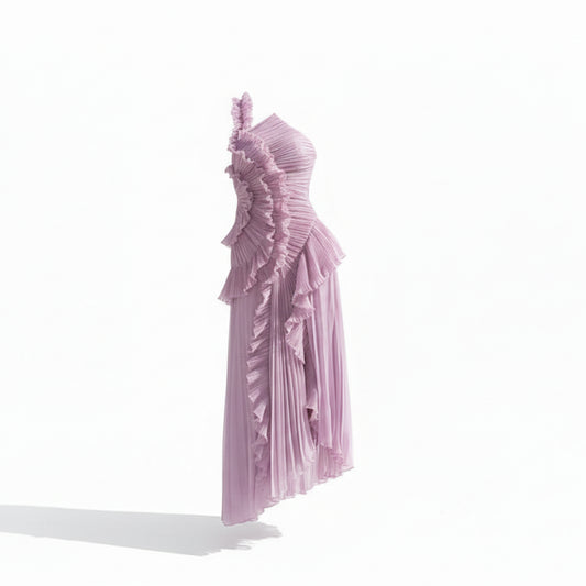 Woman wearing a one-shoulder lavender dress with ruffled details on a white background