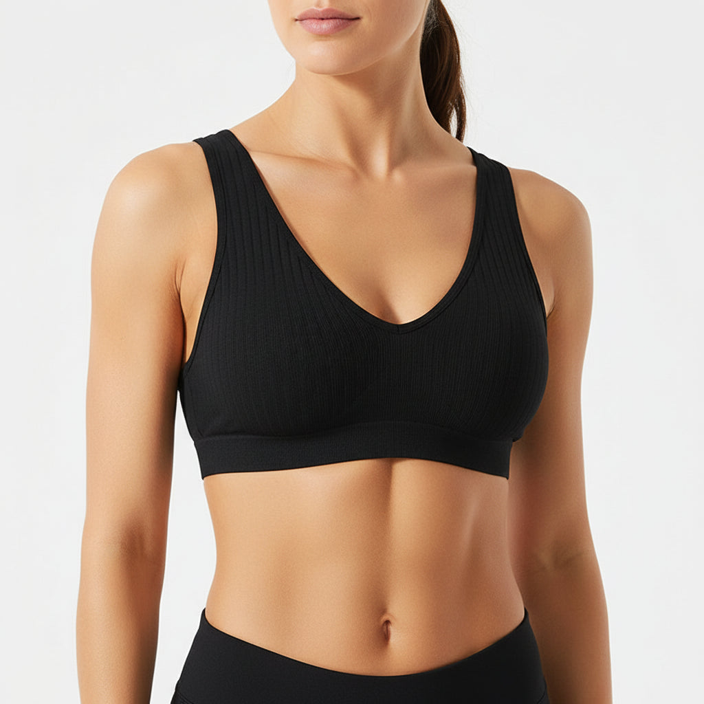 Black bralette on a white background with a subtle pattern