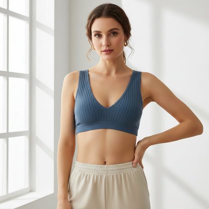 Blue ribbed bralette on a white background with small yellow stars