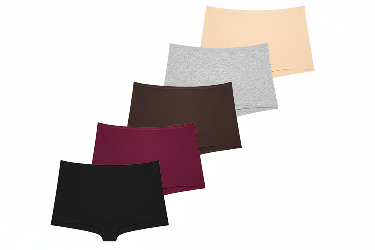 Set of five women's underwear pieces in various colors on a beige background.