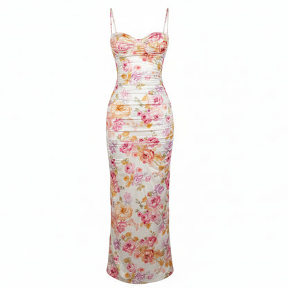Woman wearing a floral strapless dress against a plain background
