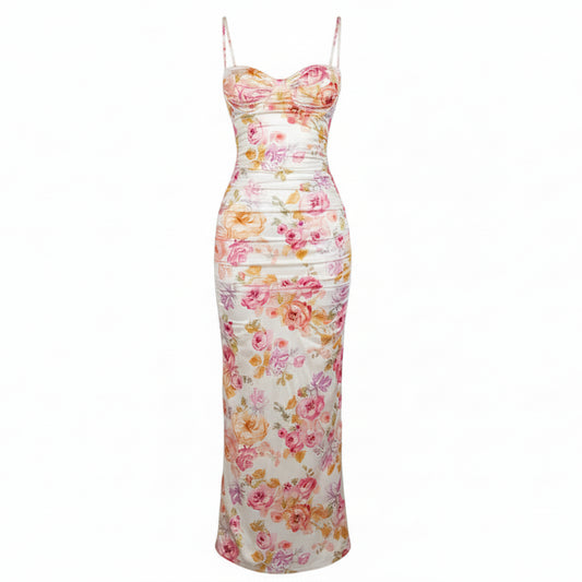 Woman wearing a floral strapless dress against a plain background