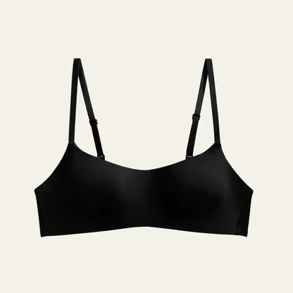 Black bra with thin straps on a light gray background