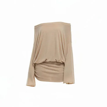 Woman wearing a beige off-shoulder dress on a white background