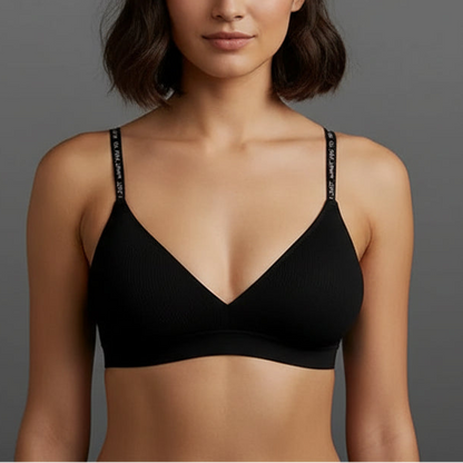 Black bra on a mannequin against a gray background