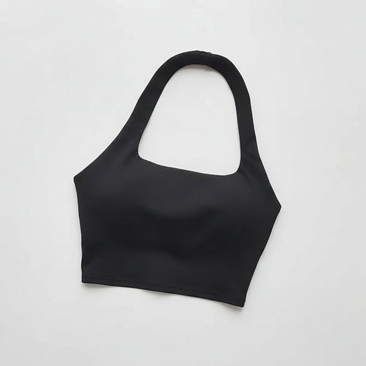 Black crop top on a light gray background