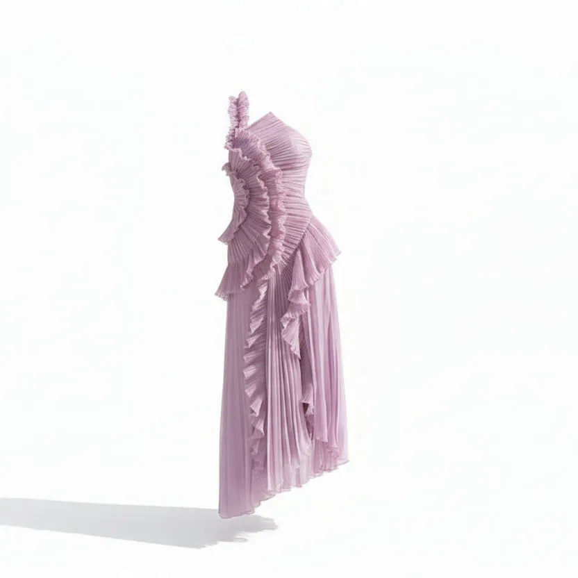 Woman wearing a one-shoulder lavender dress with ruffled details on a white background