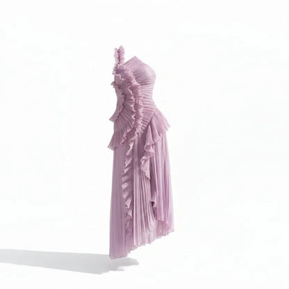 Woman wearing a one-shoulder lavender dress with ruffled details on a white background