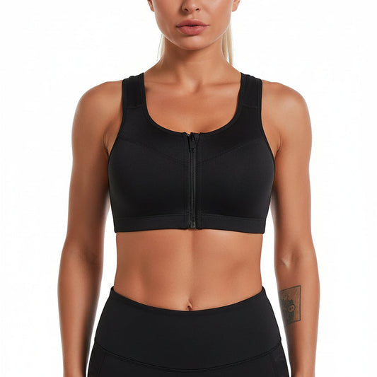 Black sports bra worn by a model with a close-up inset showing the design.