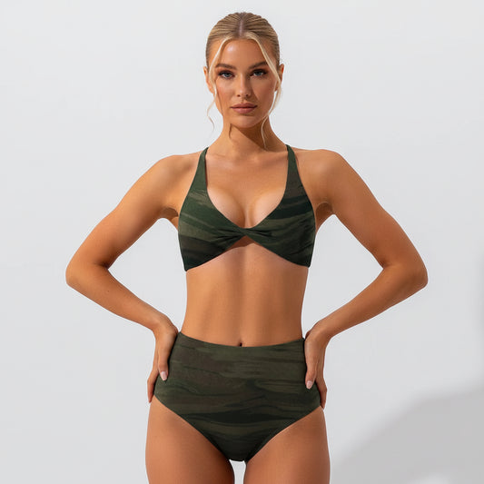 Green sports bra and leggings on a plain background