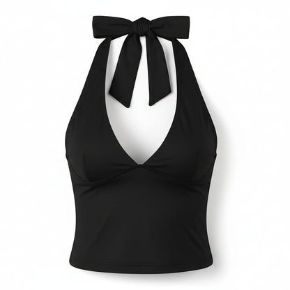 Pink halter top with tie straps on a white background